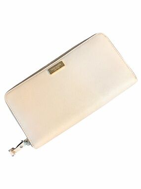 kate spade cream zip-around wallet with gold logo
